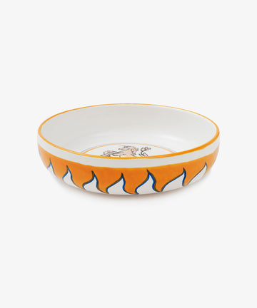 Palio Pasta Bowl in white glazed ceramic with orange and blue accents and tower and unicorn motif, side view.