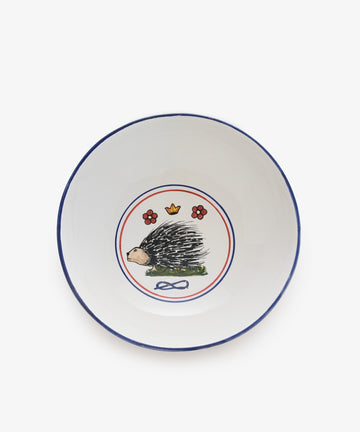 Palio Serving Bowl. Large white glazed ceramic bowl with blue and red accents and porcupine motif. 
