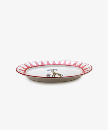 Palio Serving Platter. Glazed ceramic oval plate in red and white designs with giraffe motif, side view.