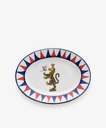 Palio Serving Platter. Glazed ceramic oval plate in red and blue designs with panther motif.