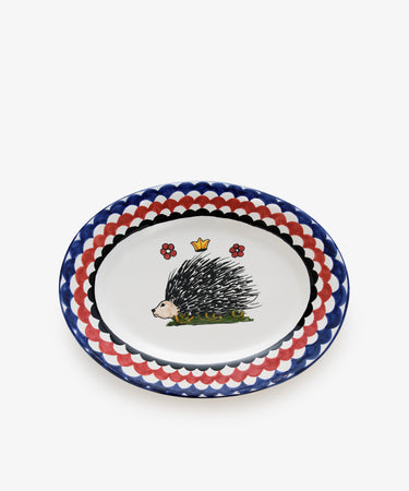 Palio Serving Platter. Glazed ceramic oval plate in red and navy designs with porcupine motif.
