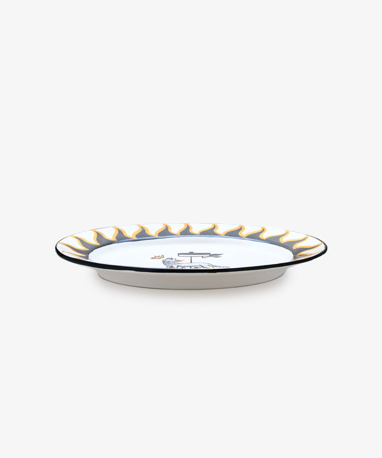 Palio Serving Platter. Glazed ceramic oval plate in black and yellow designs with wolf motif, side view.