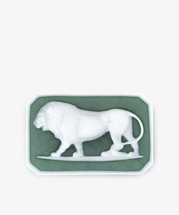 Ancient Lion Soap: Features a white cameo relief of a lion walking left, sculpted intaglio-style, set on a green rectangular base with beveled corners.