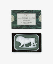 A box labeled Ancient Lion Soap showcases a sculptural bar with a white lion relief, set against a green and black marble-patterned background.