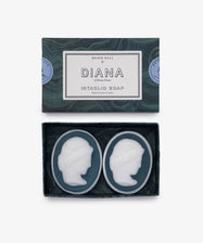The Diana Soap, Set of 2, features two oval neoclassical soaps with a raised woman's profile in classical style—an elegant addition to any luxury bathroom.