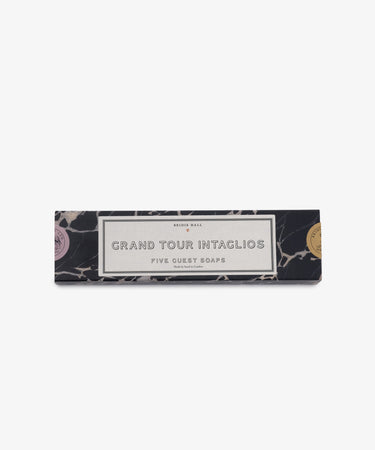 A rectangular black and white marbled box labeled Grand Tour Collection of Intaglio Soaps, Set of 5, inspired by classical cameos, is displayed against a white background.