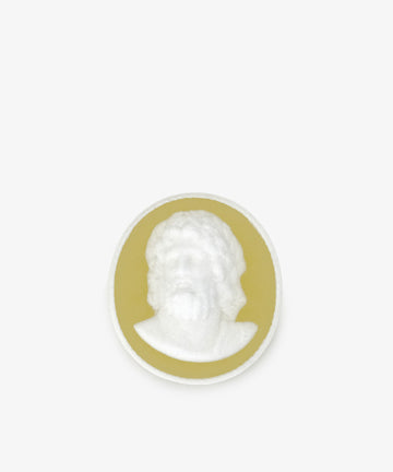 A round Hercules Soap featuring a white cameo relief of a bearded man's head and shoulders, set on a yellow background against a plain light surface.