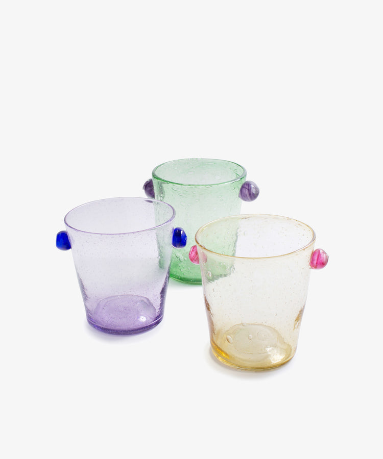 The Vincent Vase / Ice Bucket, featuring textured glass in purple, green, and yellow with small colored side knobs, showcases contemporary design and is displayed on a plain white background.