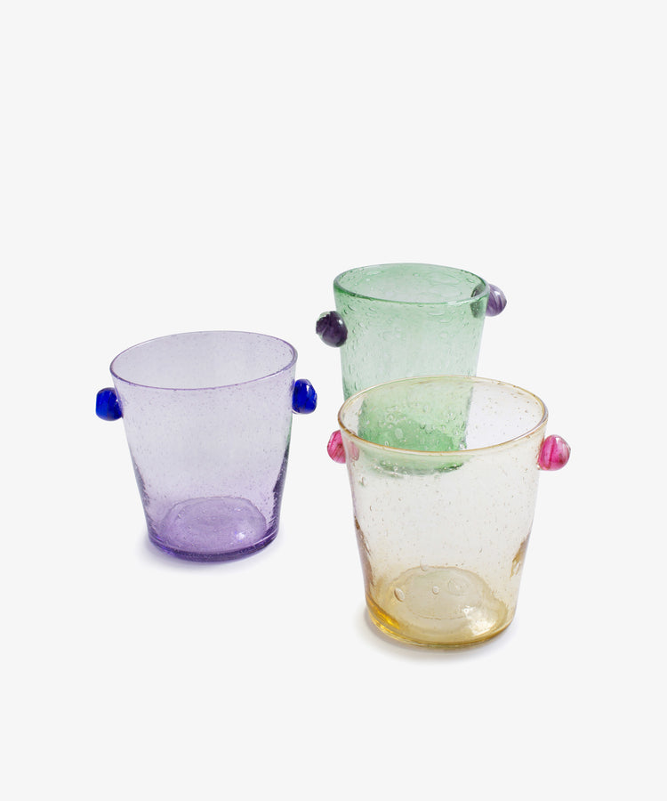 The Vincent Vase / Ice Bucket features a contemporary design in translucent purple, green, and yellow with small colored side handles, displayed against a white background.