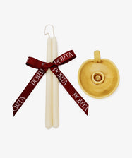 The Sparks Flying Bundle features two white tapered candles tied with a PORTA wine red ribbon beside a yellow ceramic handled candleholder, creating a charming Valentine’s Day gift set on a crisp white background.