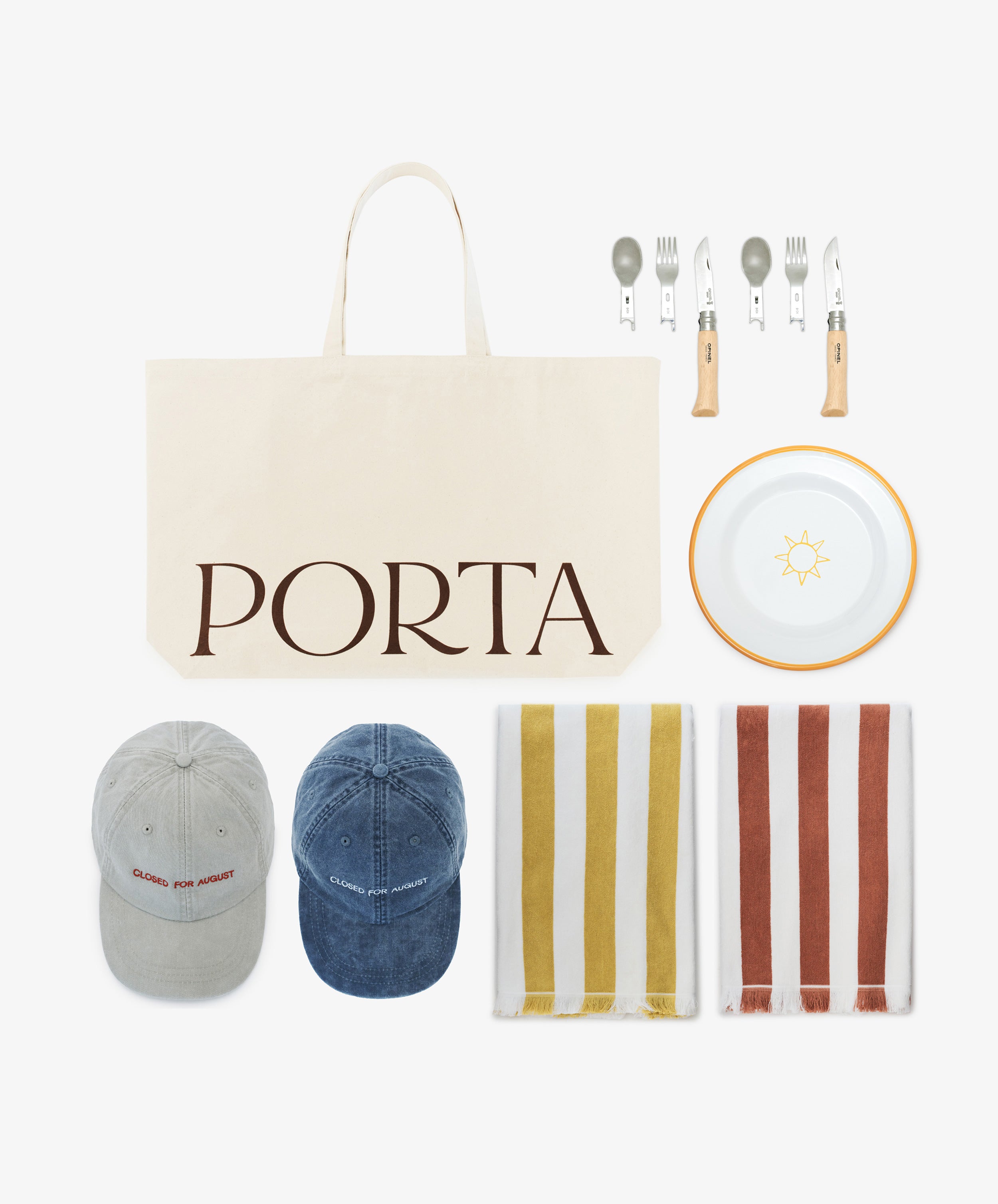 The Sole Weekender, featuring a canvas tote, picnic cutlery, sun plate, two striped towels (yellow and red), and two baseball caps (gray and blue), makes the perfect set of summer beach essentials—all arranged on a white background.