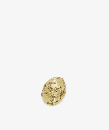 The Walnut Paperweight, a small and irregularly shaped gold nugget resembling a brass walnut, is shown on a plain white background.