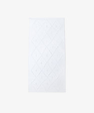 The Gaia Floor Mat is a white, rectangular floor mat featuring a diamond-textured design and made from recycled fabric, shown on a plain white background.