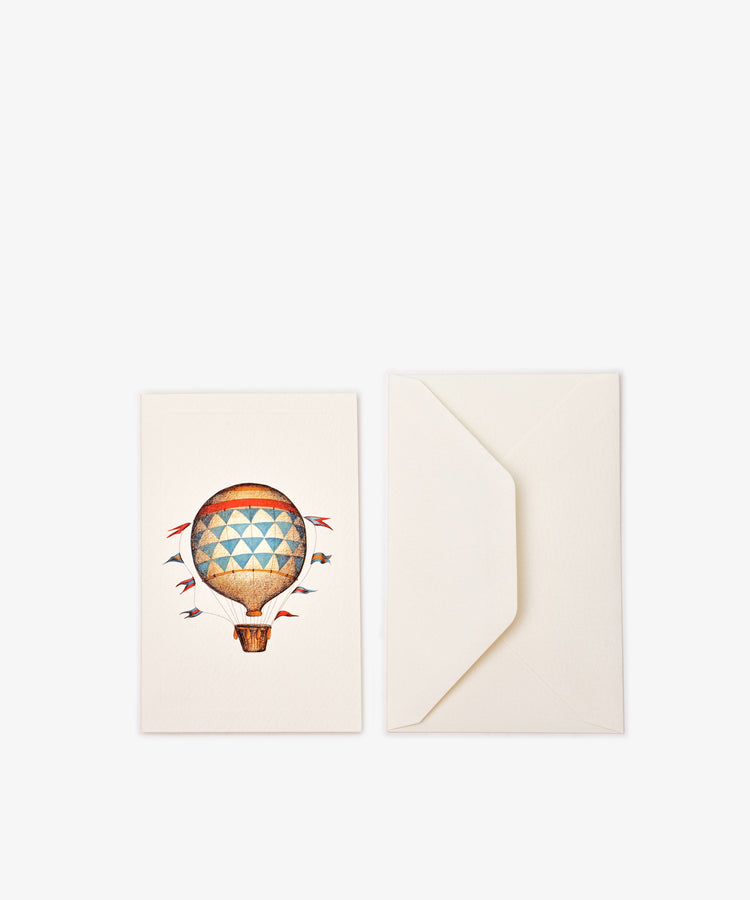 The Palloncino Card & Envelope Set of 12 features cream-colored hot air balloon cards with charming illustrations and matching envelopes—ideal for fans of Italian stationery and unique greeting cards.
