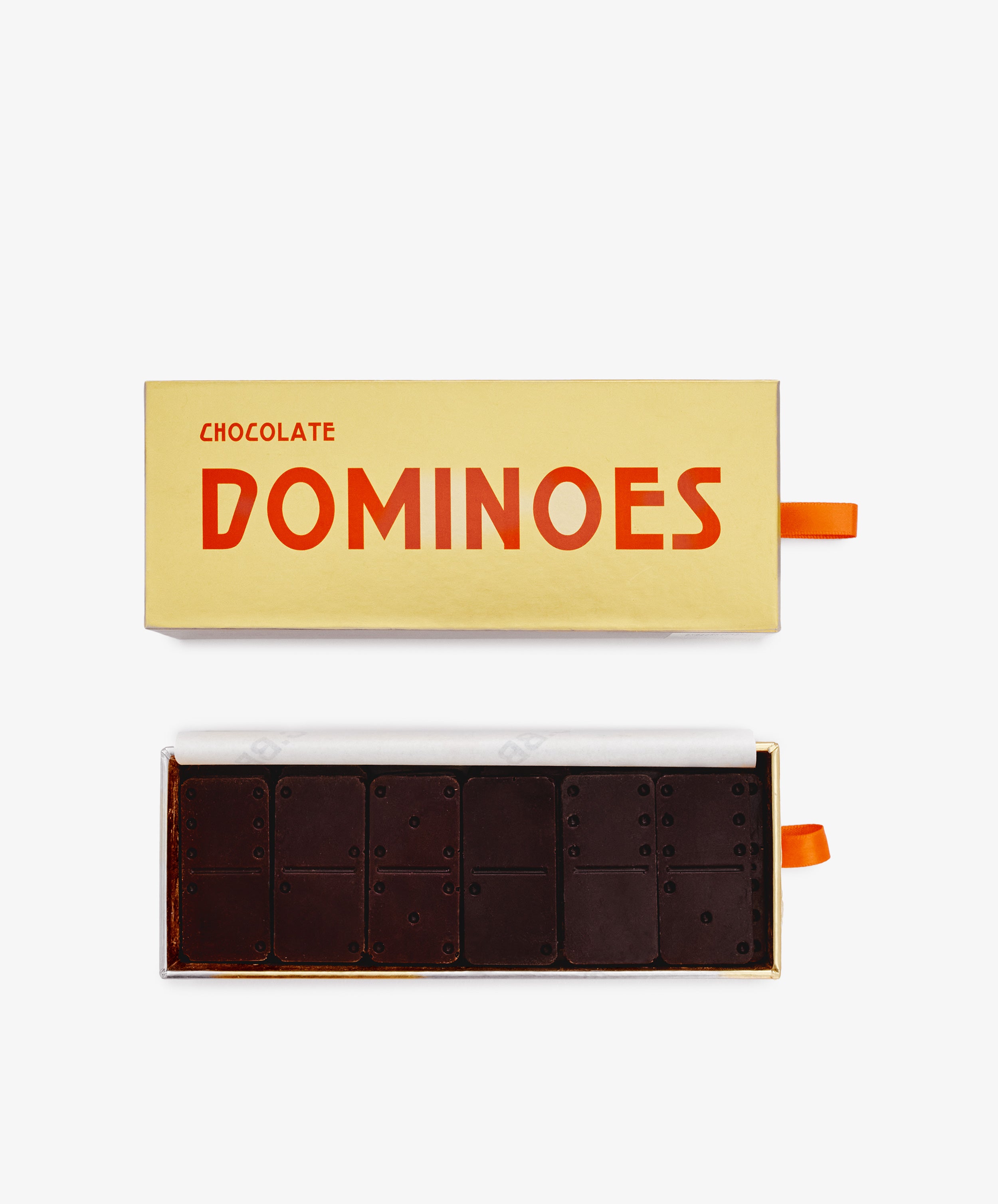 An open rectangular box labeled Chocolate Domino Set displays luxury dark chocolates shaped and marked like dominoes—a delightful holiday gift.