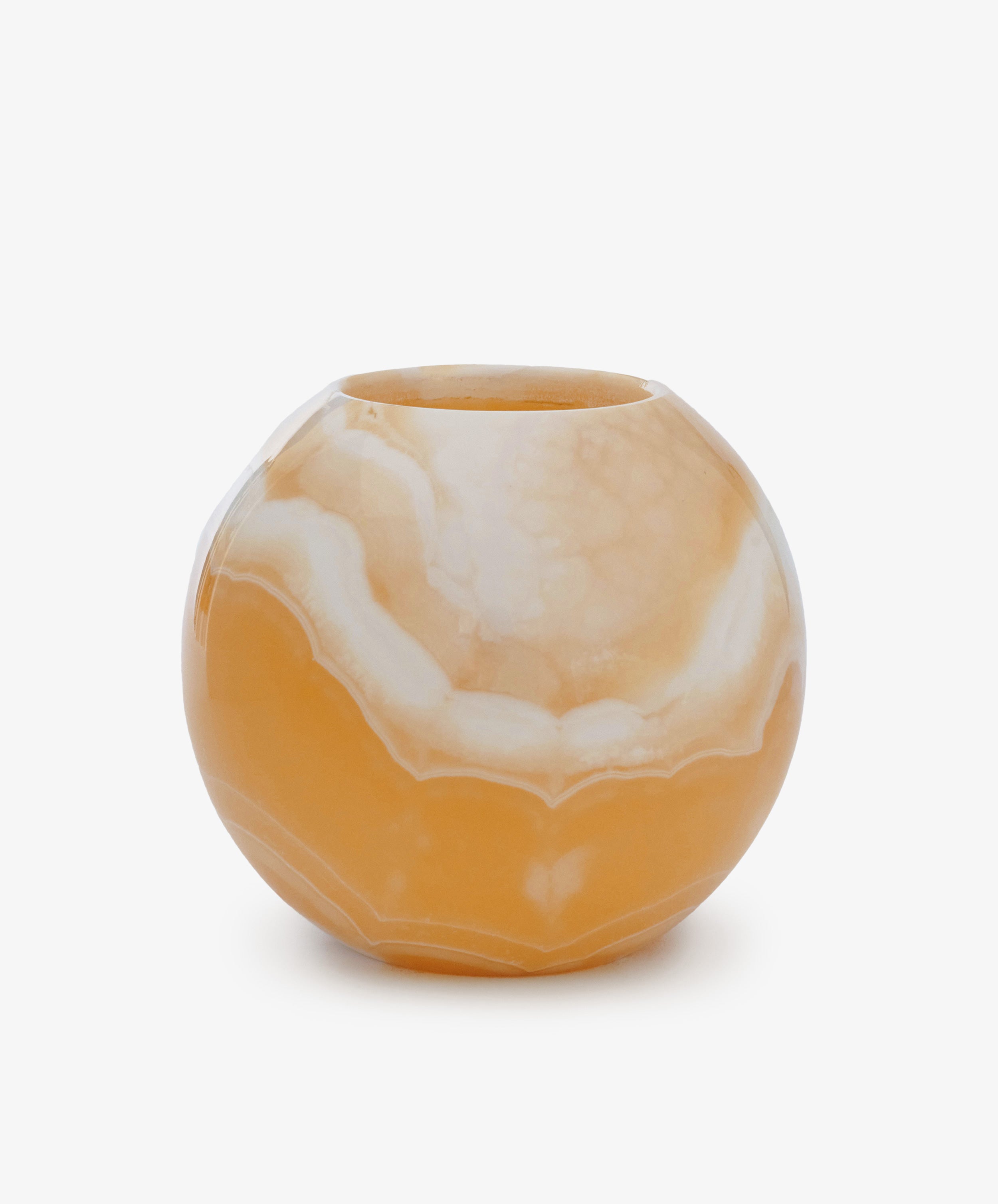 The Akila Candleholder is a round, orange and white marble-patterned vase with a wide body and narrow opening, handcrafted from Egyptian Alabaster in Luxor—perfect as a unique candle holder or decorative accent.