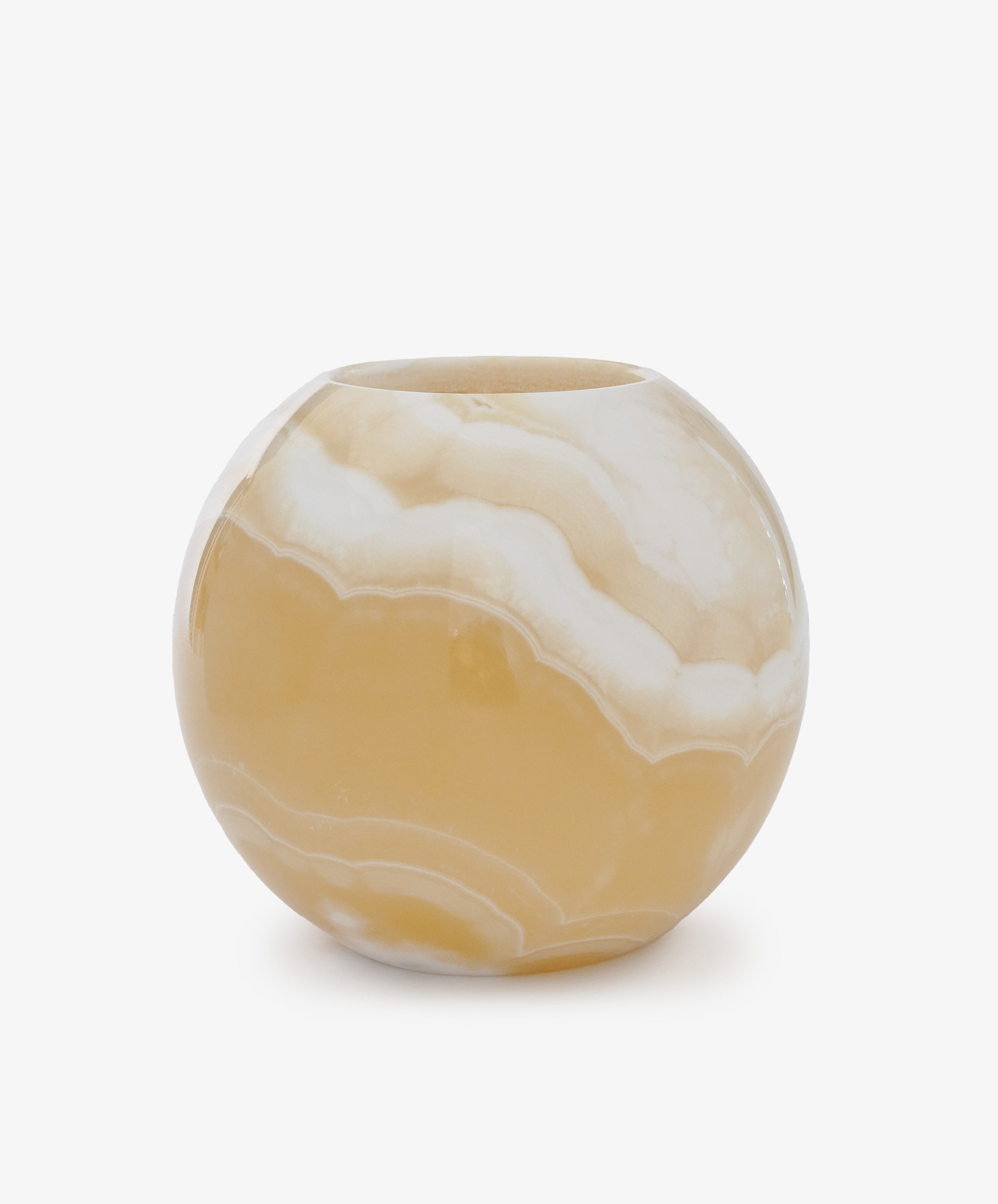 The Akila Candleholder is a round Egyptian alabaster piece with a glossy beige and white finish, showcasing natural marble-like swirls, displayed on a plain white background.