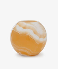 The Akila Candleholder is a round vase with a glossy marbled orange and white finish, inspired by handcrafted Egyptian Alabaster, shown against a plain white background.