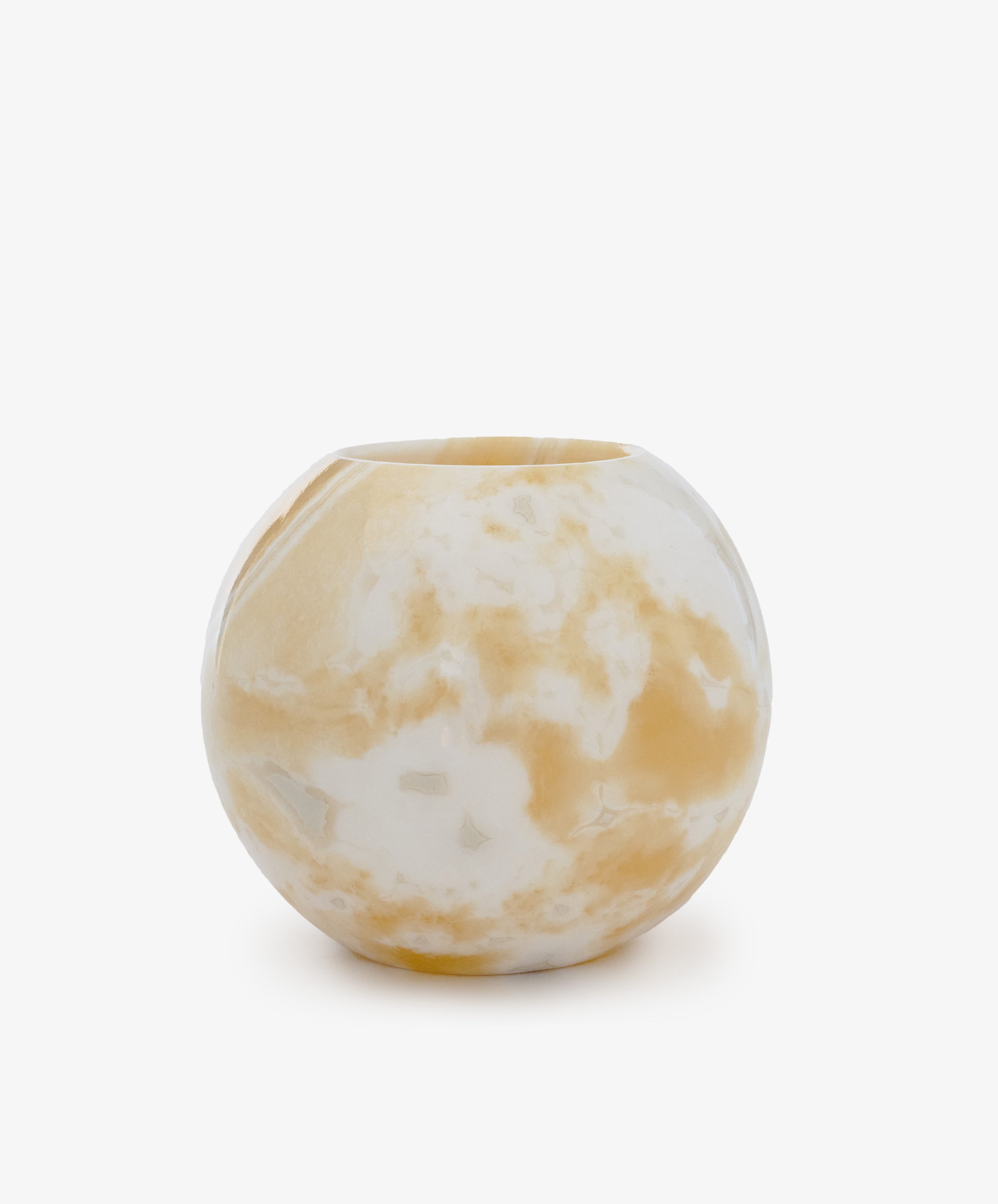 The Akila Candleholder is a round Egyptian alabaster piece with a smooth finish and white-beige marbled patterns, shown on a plain white background.