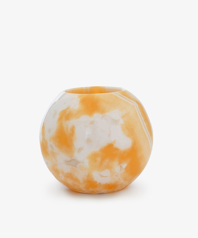 The Akila Candleholder features a glossy, marbled orange and white finish reminiscent of Egyptian alabaster, showcased against a plain white background.