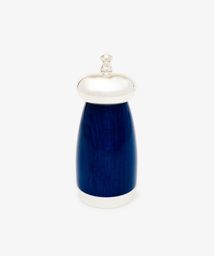 The Giorgio Pepper Mill, with Italian design in blue and silver, features a rounded body, a silver top knob, and a silver base. It stands upright on a plain white background.