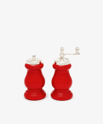 The Giorgia Pepper Mill and Salt Shaker, featuring matching red bodies and silver tops in elegant Italian design, are displayed side by side on a white background.
