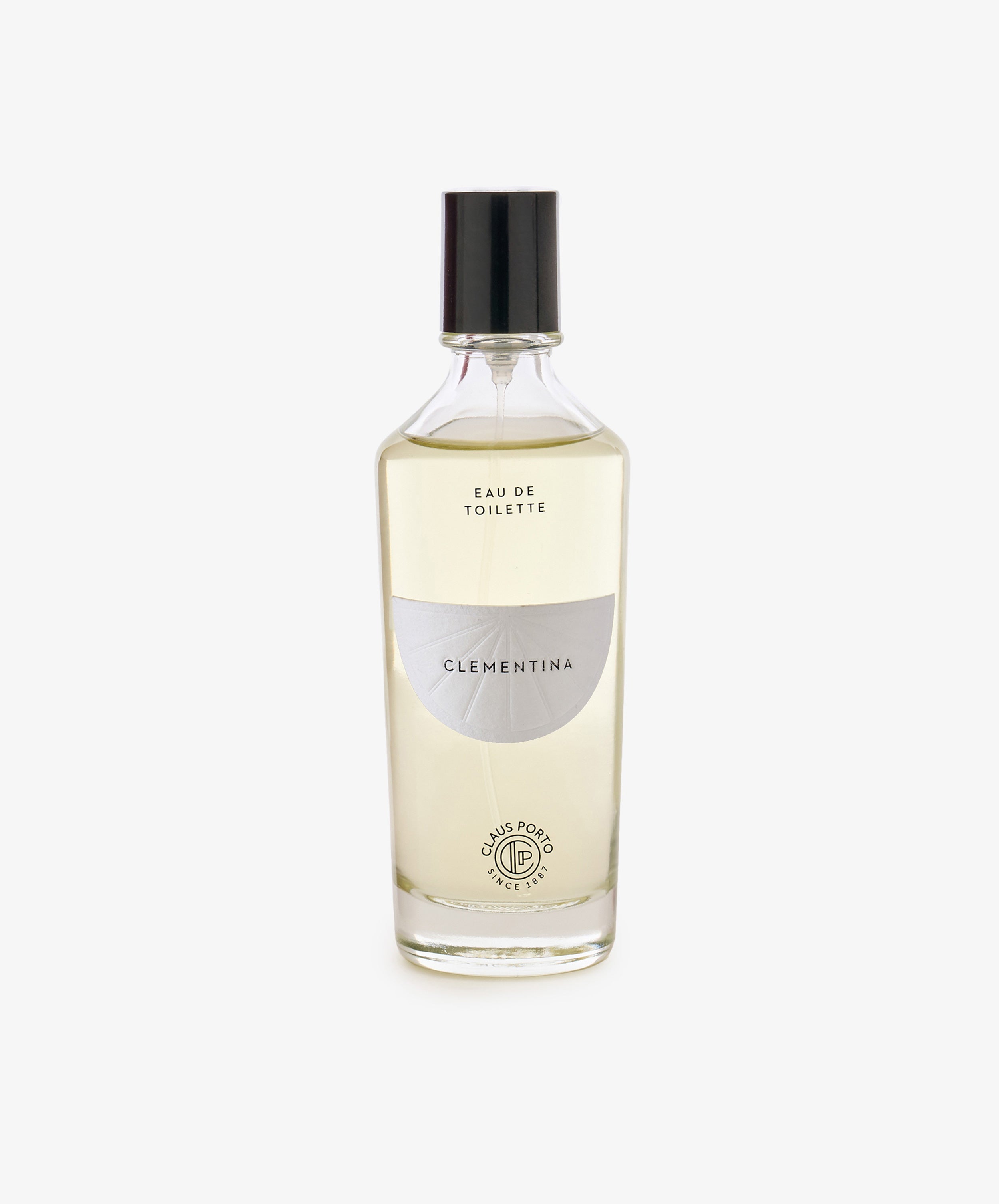 Clear glass bottle of Clementina Eau de Toilette with a black cap, white label, and light yellow liquid, featuring bergamot notes, photographed on a white background.
