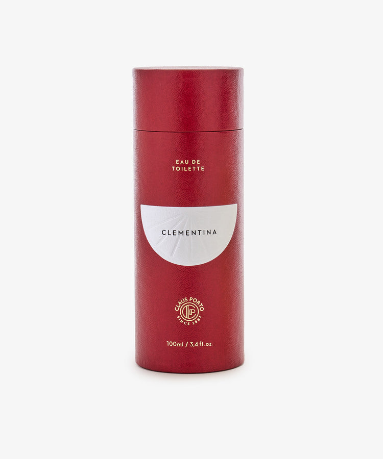 Clementina Eau de Toilette, 100ml by Claus Porto, in a red cylindrical bottle with orange flower and bergamot notes, shown on a white background.