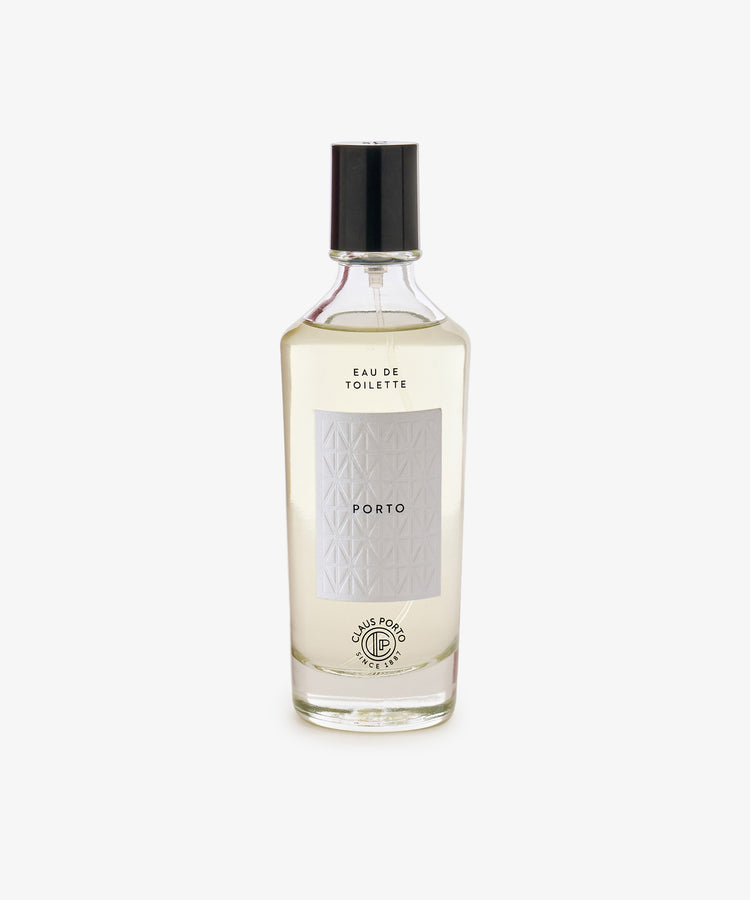 A clear glass bottle of Porto Eau de Toilette with a black cap, boasting a citrus scent, set against a plain white background.