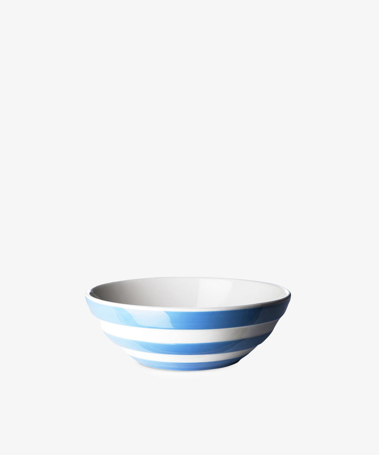 The Betty Cereal Bowl is a white ceramic bowl with horizontal light blue stripes, inspired by classic UK West Country pottery, shown against a plain white background.