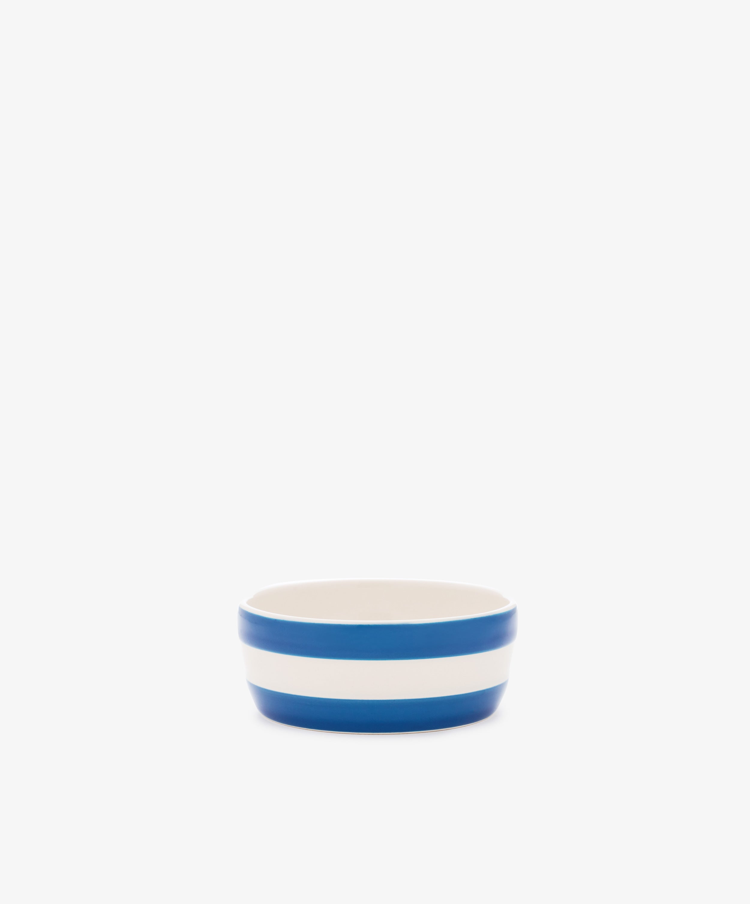 Betty Dip Dish: small white ceramic condiment dish with two bold horizontal blue stripes, shown on a plain white background.