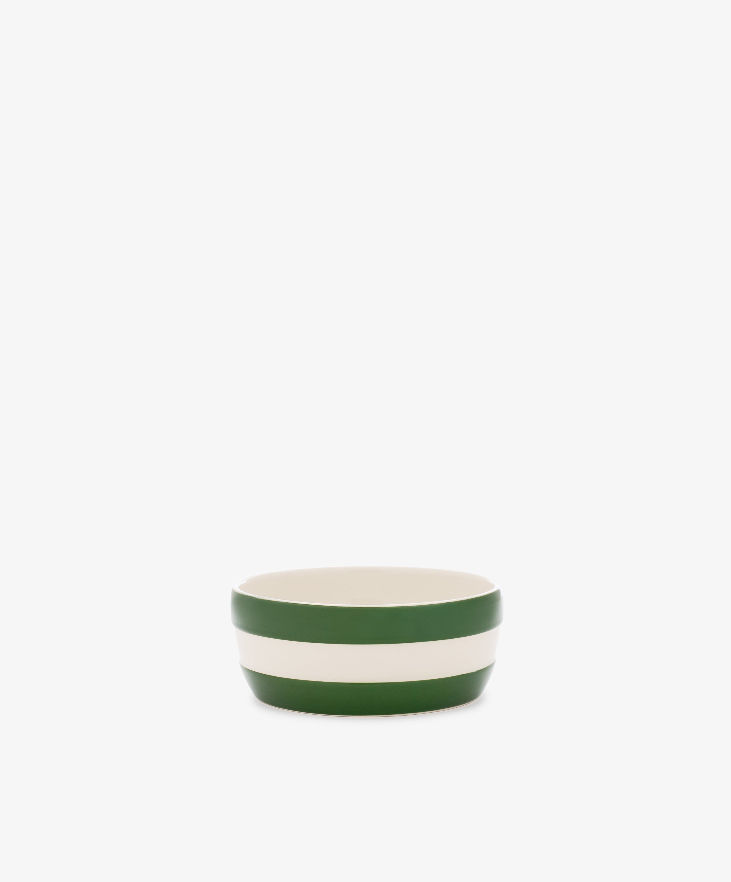 The Betty Dip Dish is a small ceramic bowl with green and white stripes, ideal as a striped pottery condiment dish on any table setting.