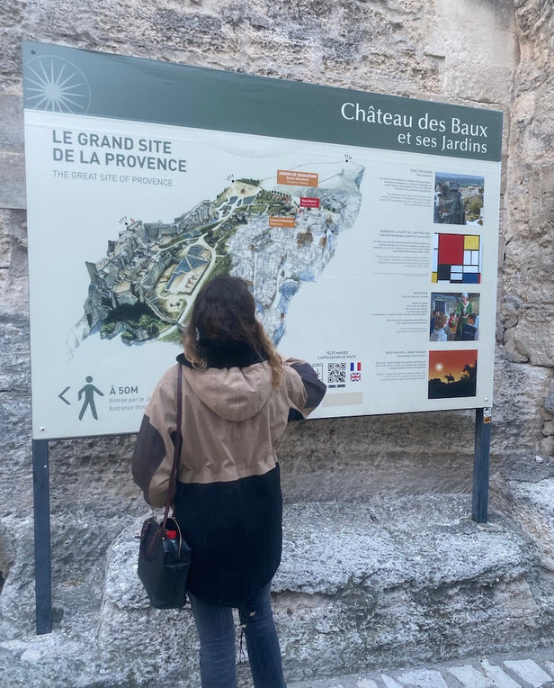 woman looking at a map outside