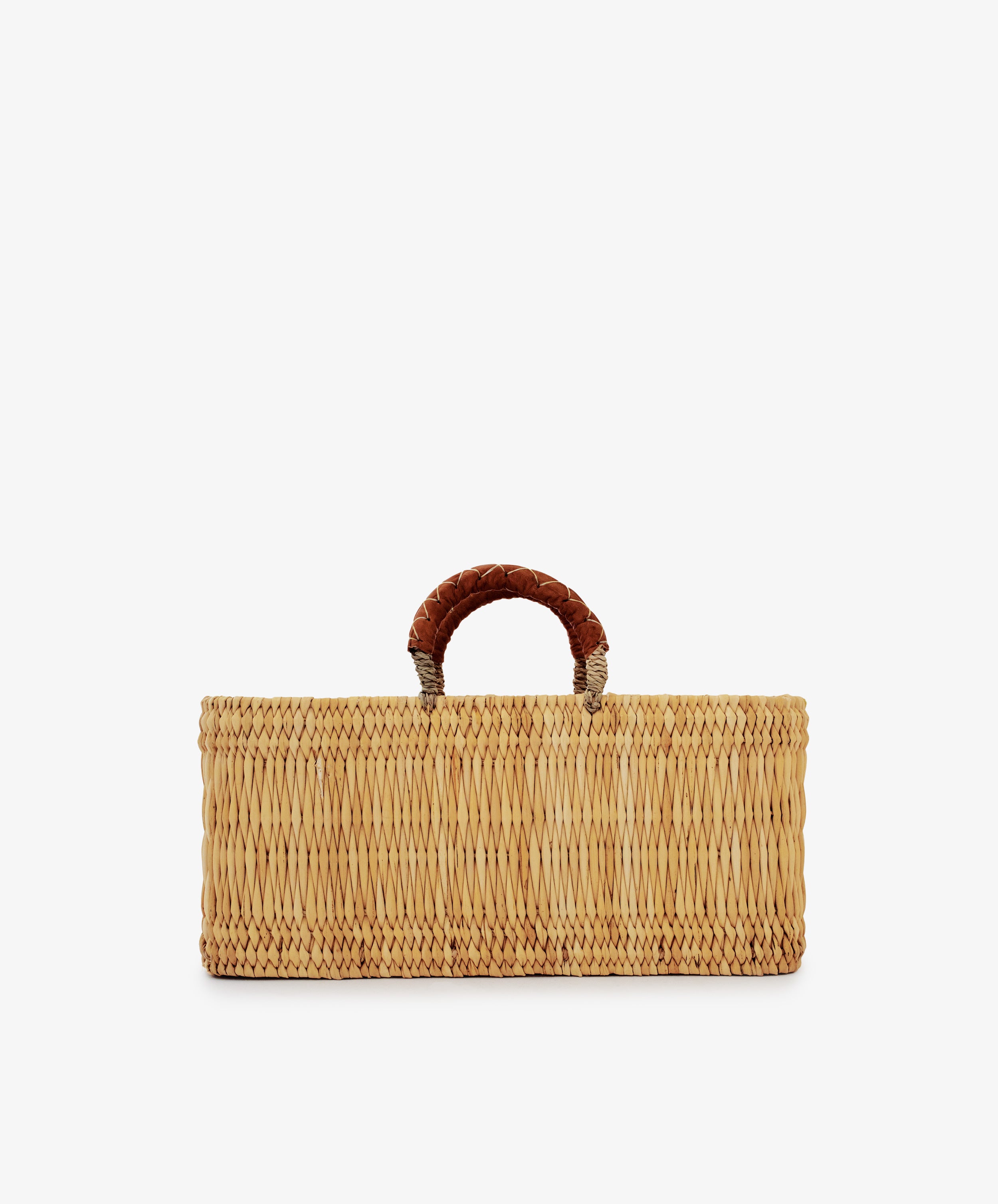 Reed Basket with Leather Handles, rectangular in shape and featuring a single short handle wrapped in brown leather, displayed against a plain white background.