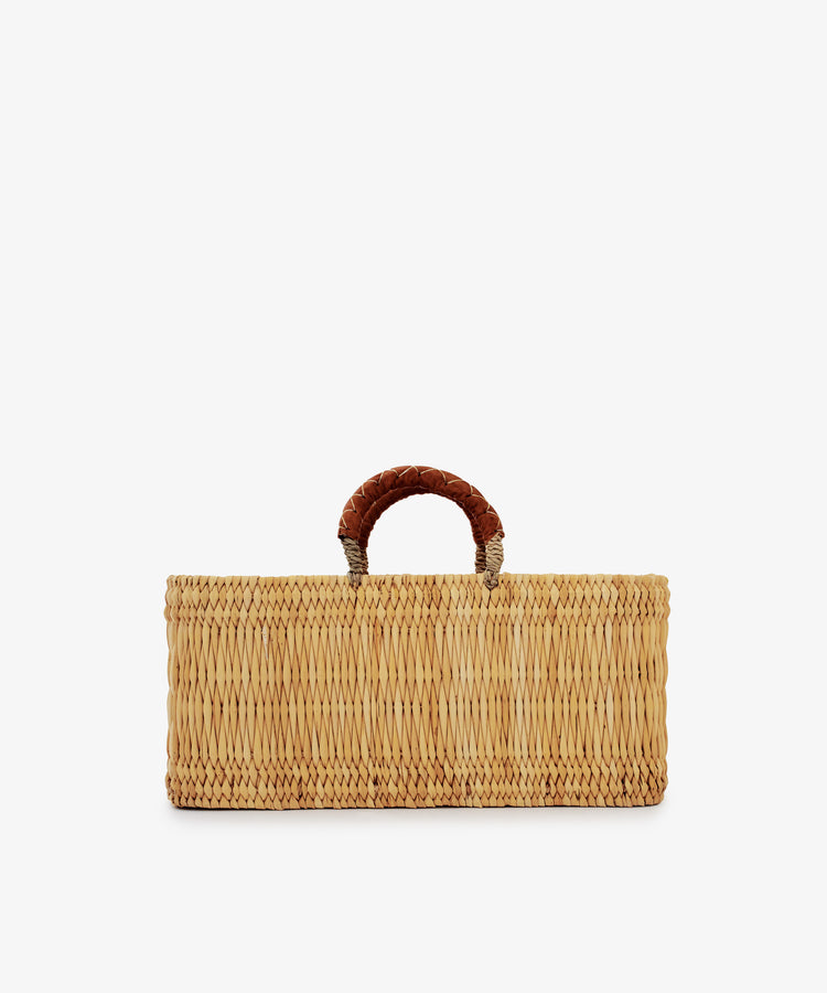 Reed Basket with Leather Handles, rectangular in shape and featuring a single short handle wrapped in brown leather, displayed against a plain white background.