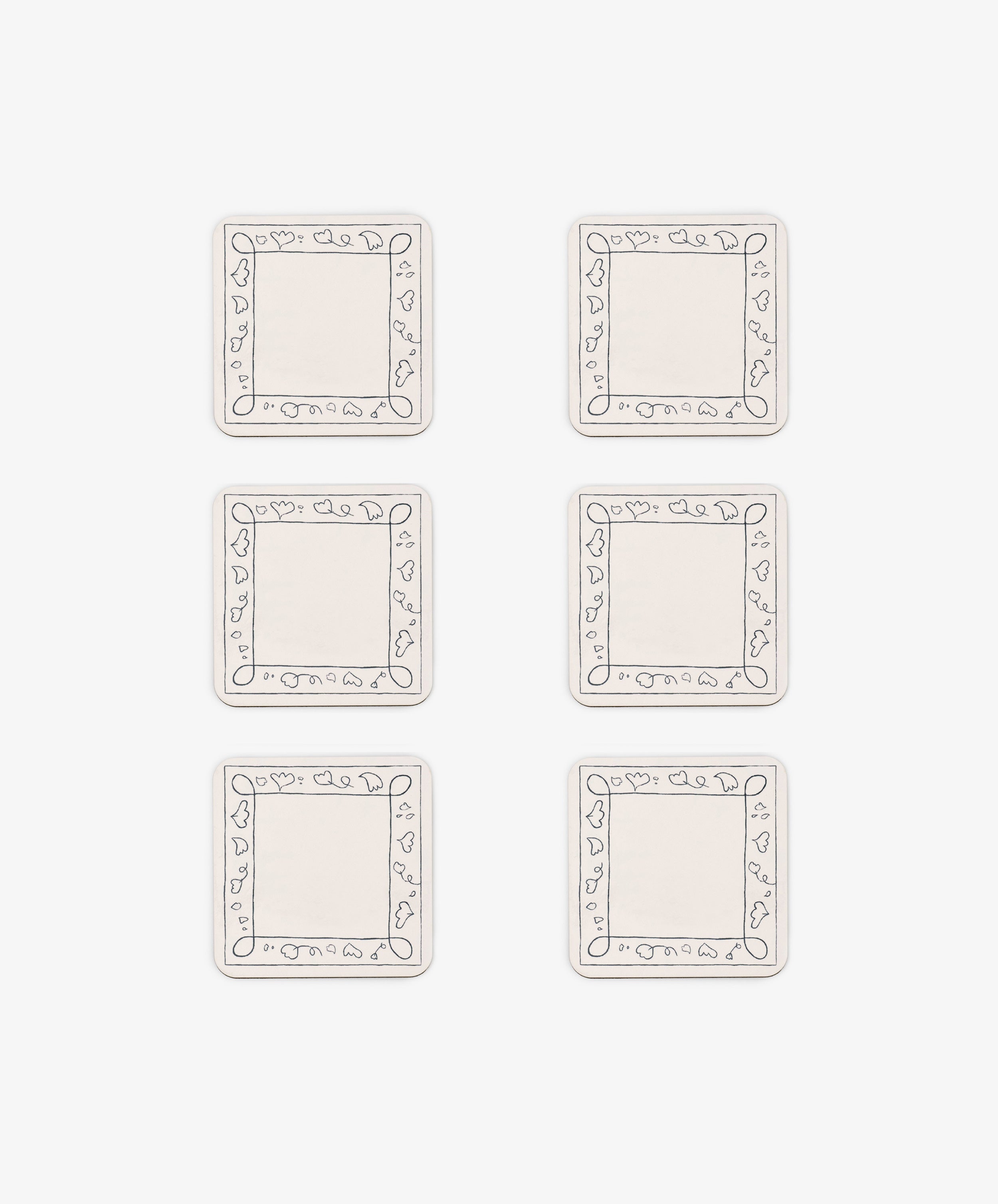 Six rectangular white Capriccio Coasters, set of 6, feature simple line-drawn borders with small heart shapes. Arranged in two columns and three rows on a white background, they echo a playful modern design.