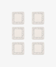 Six rectangular white Capriccio Coasters, set of 6, feature simple line-drawn borders with small heart shapes. Arranged in two columns and three rows on a white background, they echo a playful modern design.