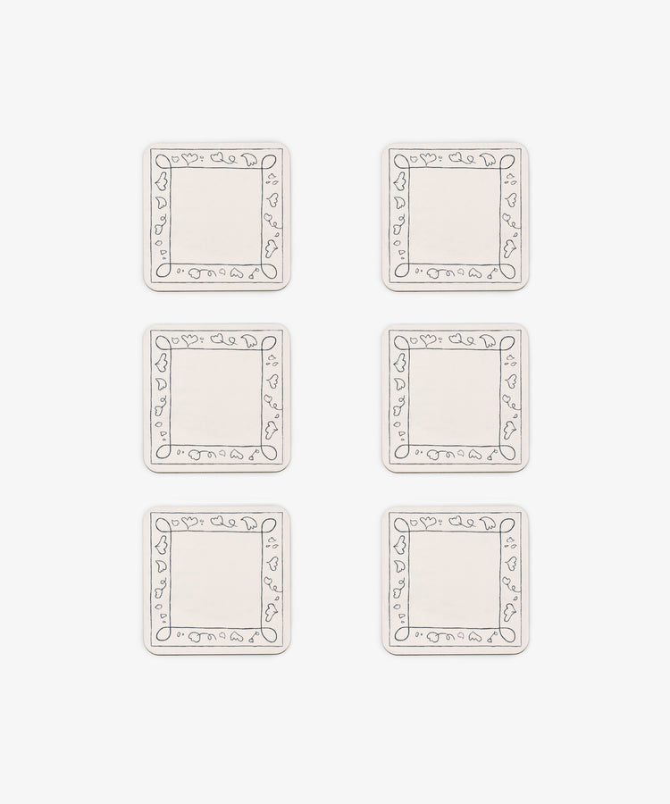 Six rectangular white Capriccio Coasters, set of 6, feature simple line-drawn borders with small heart shapes. Arranged in two columns and three rows on a white background, they echo a playful modern design.
