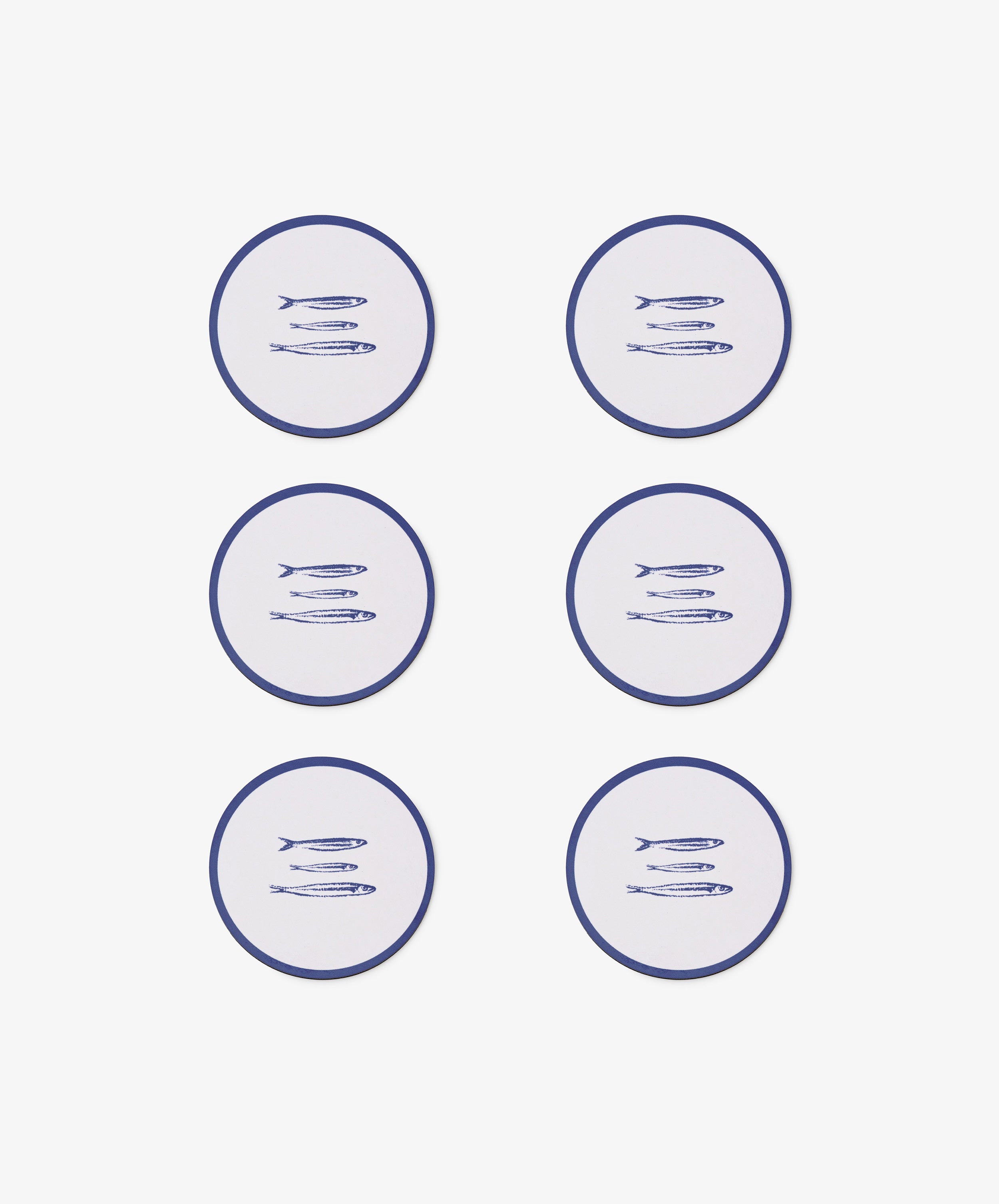 The Costa Coaster Set of 6 features round coasters with blue fish designs, arranged in two columns on a white background to add a chic touch to any table.