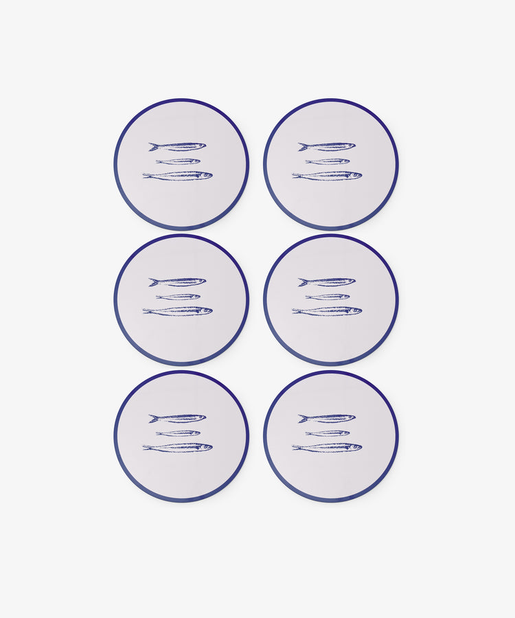 Set of six Costa Placemats featuring white, round designs with blue edges and a trio of fish illustrations—ideal for playful summer table decor or pairing with sardine-themed accents.