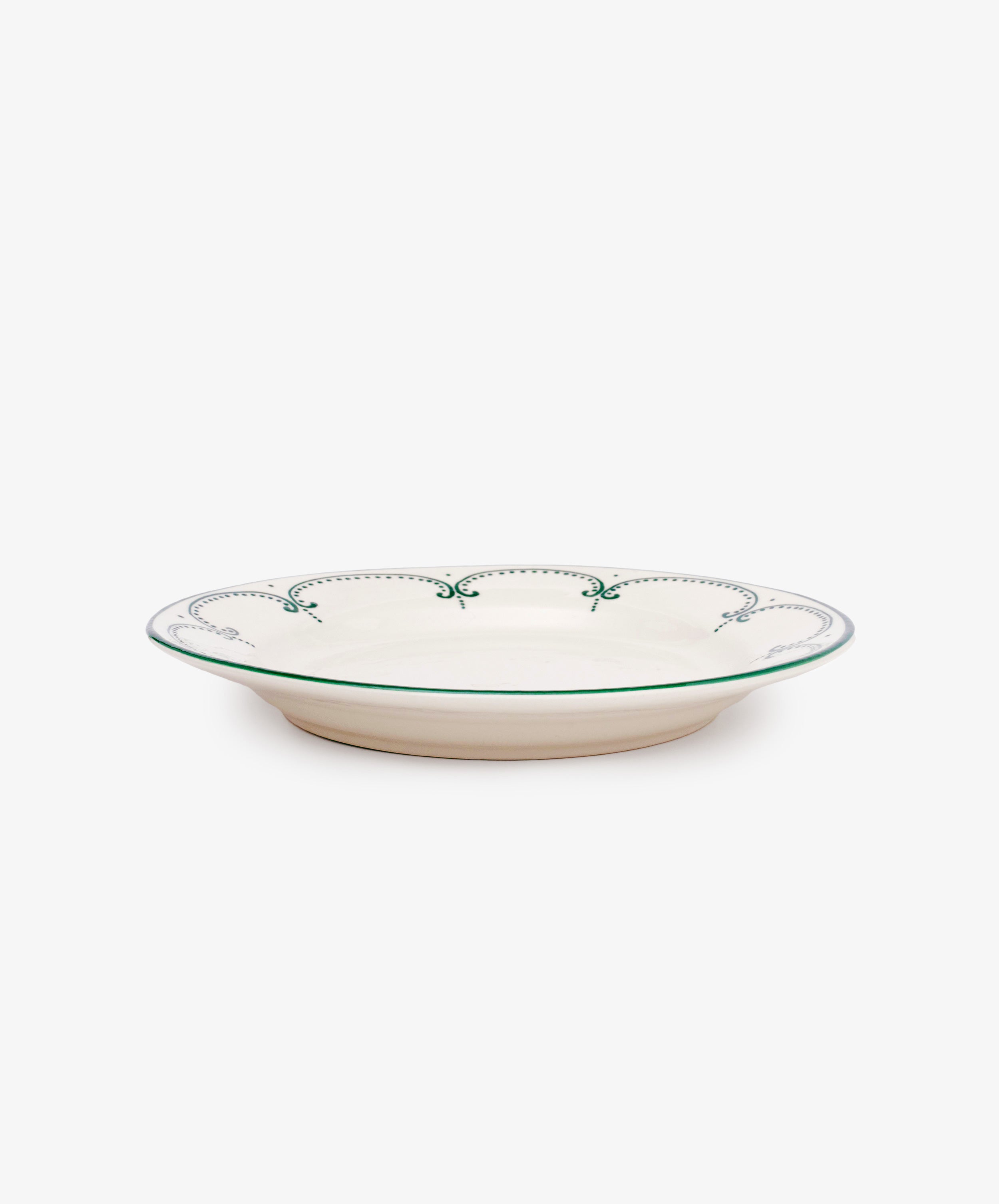 The Arco Dinner Plate, Set of 4 features shallow, round Portuguese plates with a cream base, green rim, and decorative green edge pattern, highlighting traditional design against a white background.