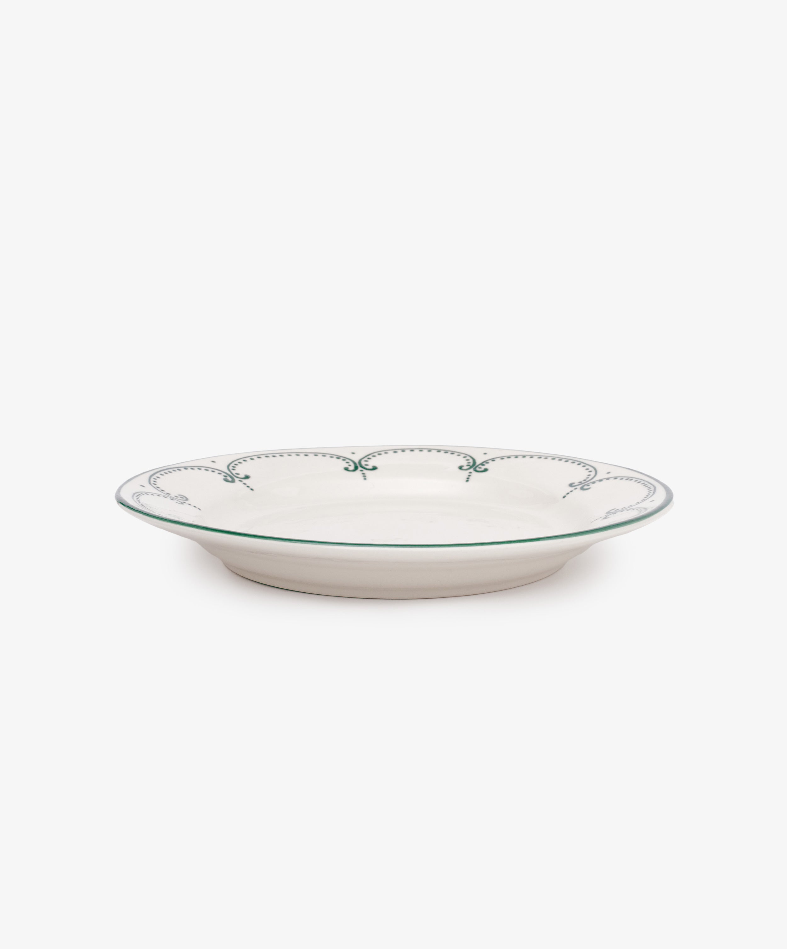 The Arco Dinner Plate, Set of 4, features white ceramic plates with a green decorative border, displayed against a plain white background.
