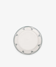 The Arco Small Plate, Set of 4, features round white ceramic plates with blue decorative borders and traditional design, displayed on a plain white background.
