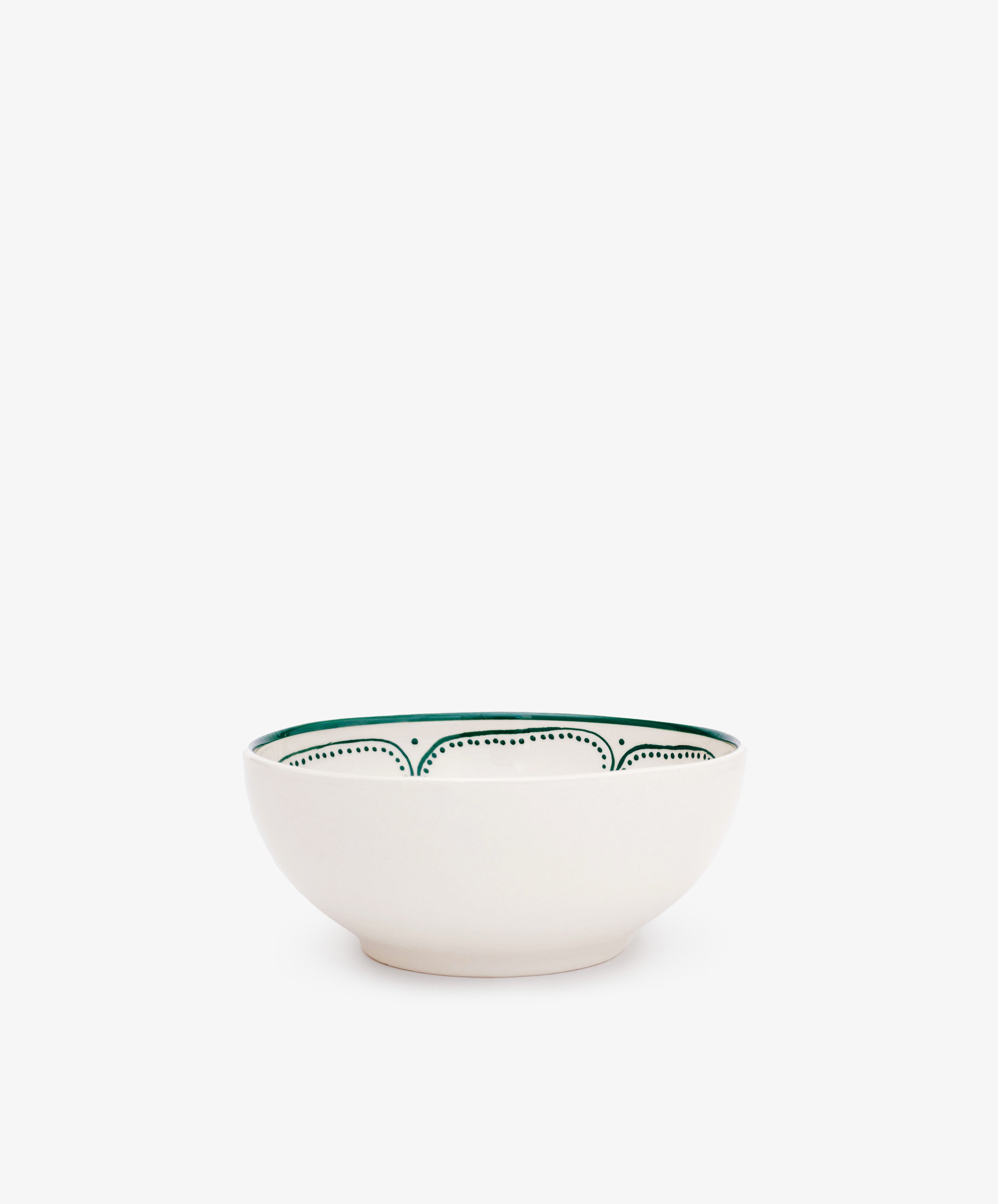 The Arco Cereal Bowl, Set of 4, features handmade white ceramic bowls with a green pattern along the inner rim, inspired by traditional Portuguese design and displayed on a plain white background.