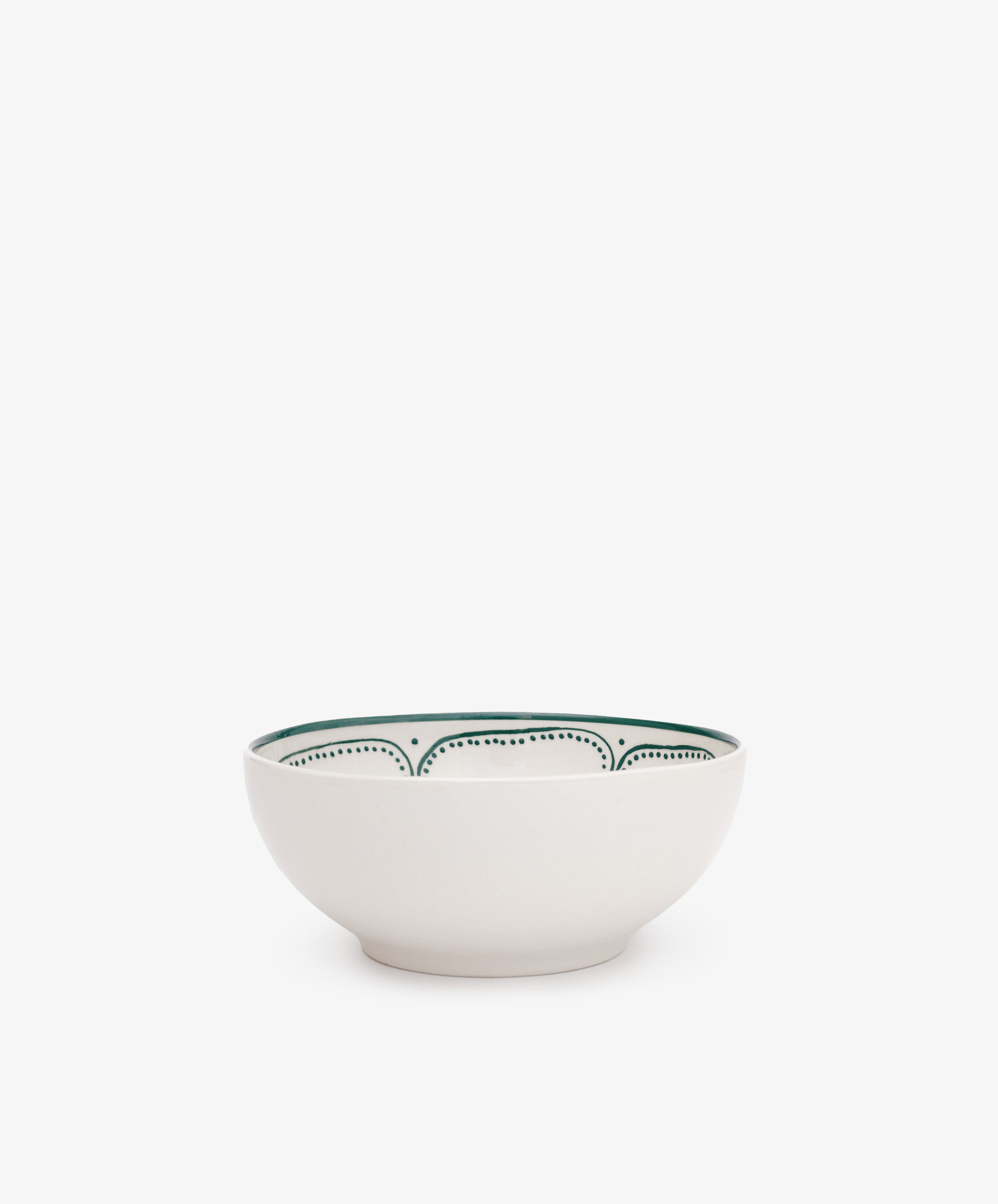 The Arco Cereal Bowl, Set of 4, features white ceramic bowls adorned with a simple green dotted pattern along the inner rim, highlighting contemporary tableware style.