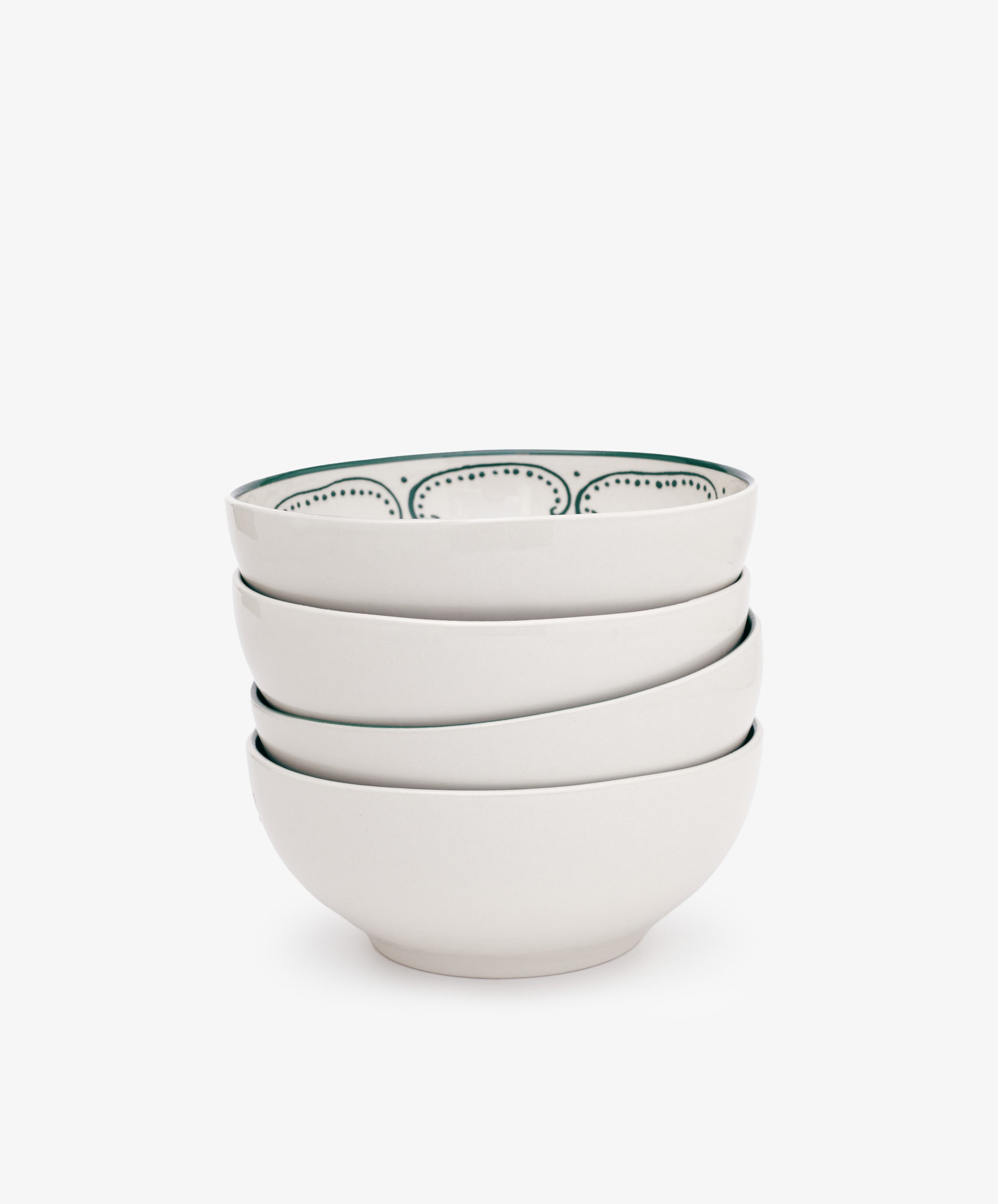 The Arco Cereal Bowl Set includes four white ceramic bowls, each with a simple dotted pattern on the inner rim—ideal for anyone who loves stylish, contemporary tableware.