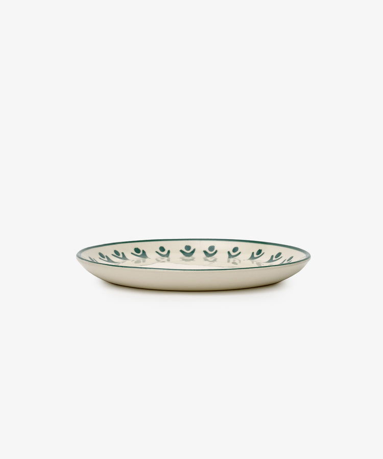 The Vito Small Plate, Set of 4, features shallow round ceramic plates with a cream base and green circular rim pattern—handmade for everyday use and shown on a white background.