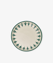 The Vito Small Plate, Set of 4, features round ceramic plates with a green geometric pattern around the edge and abstract shapes on an off-white background—ideal for everyday use.