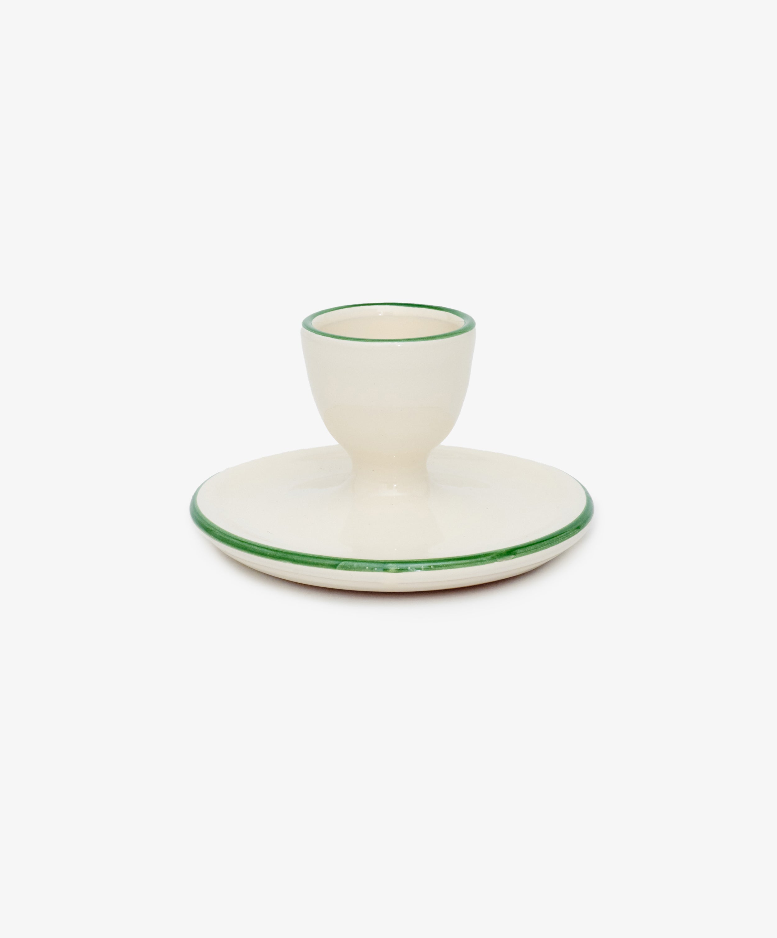 Nino Egg Cup and Candle Holder by Enza Fasano. White glazed ceramic vessel with green painted rim.