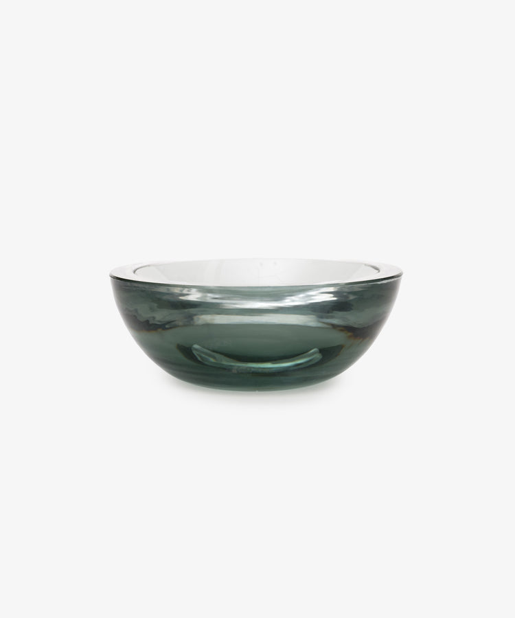 The Gem Dish is a round, transparent glass bowl with a subtle gray tint, shown against a plain white background.